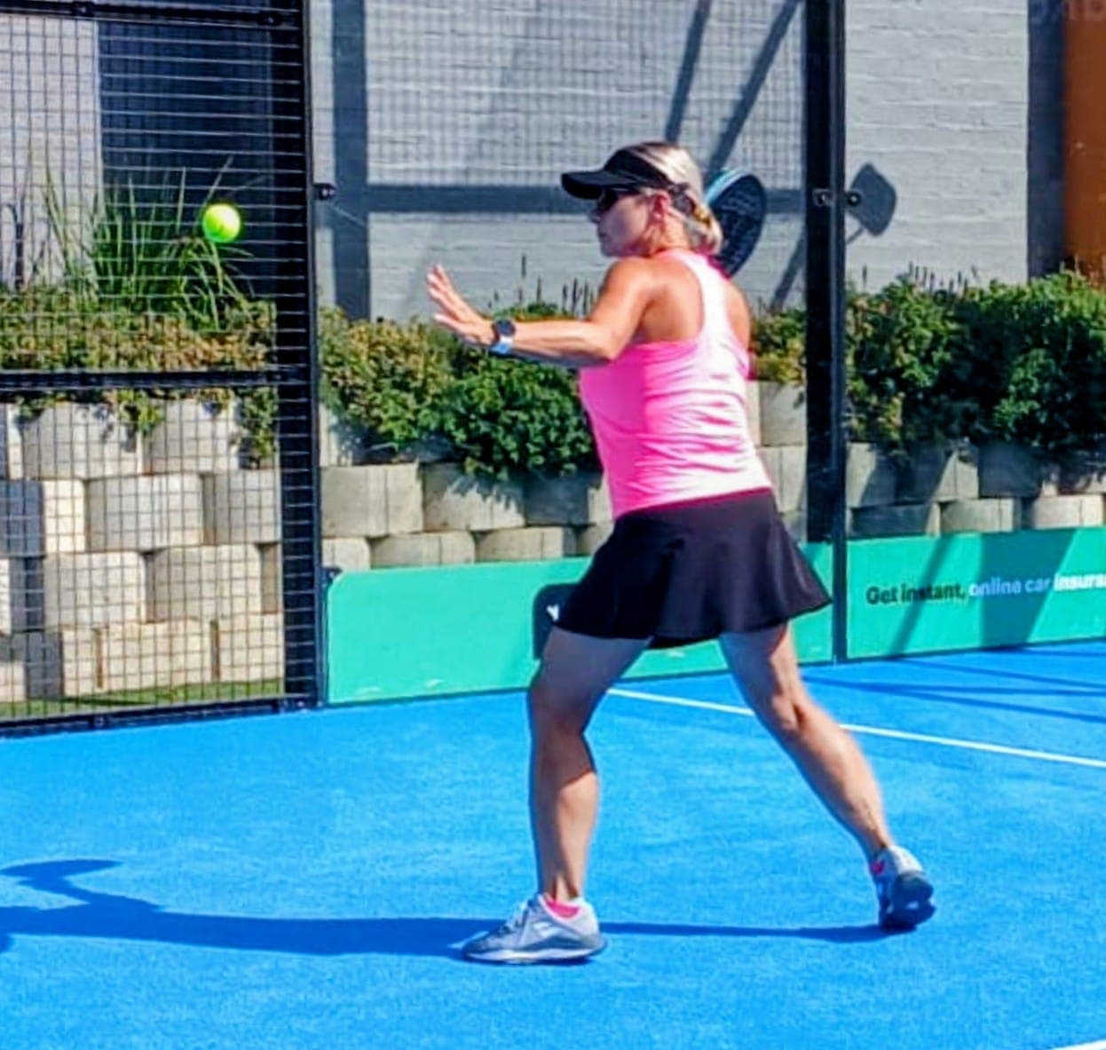Padel player during coaching session at Garden Route retreat